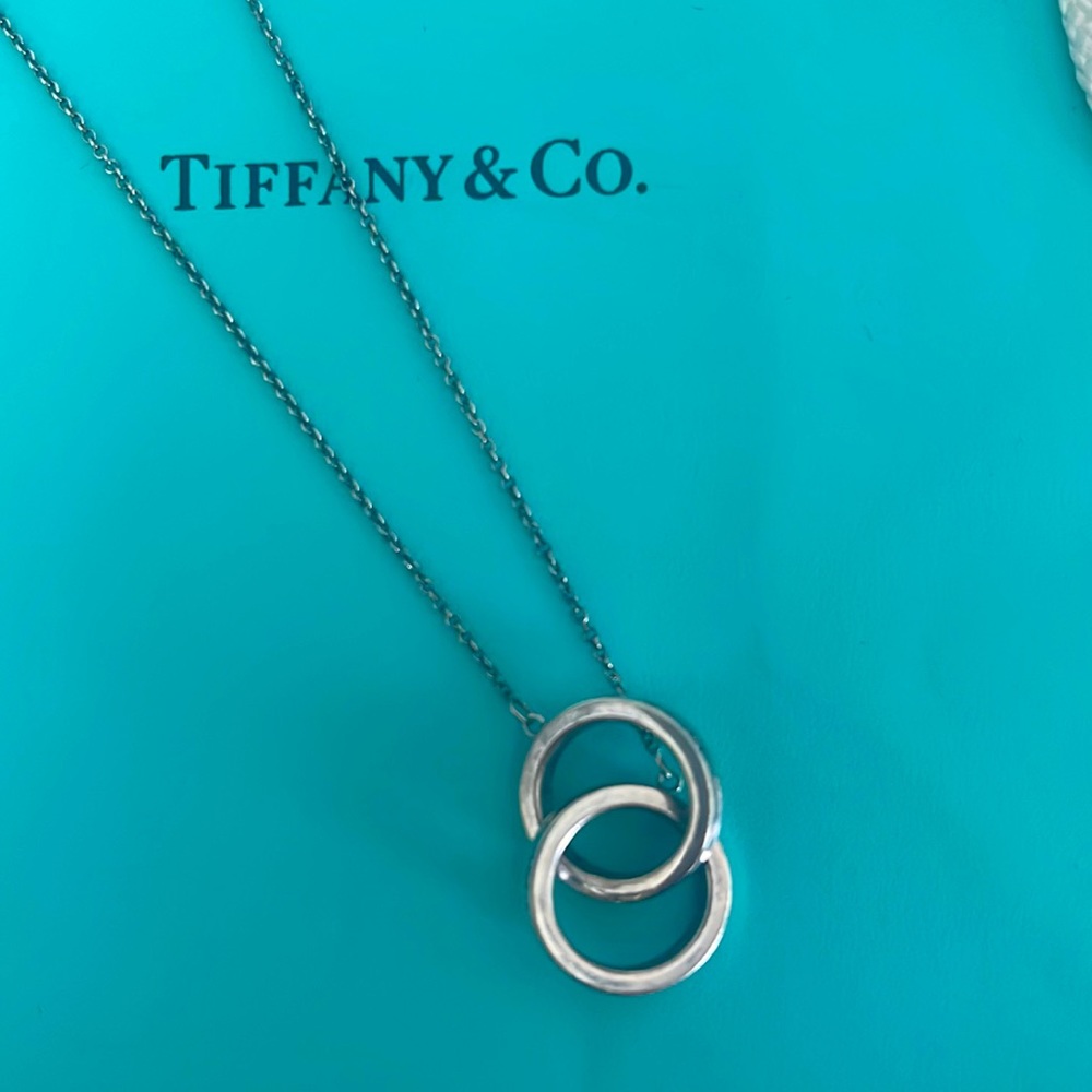 Tiffany sterling small interlock pendant 16 inch